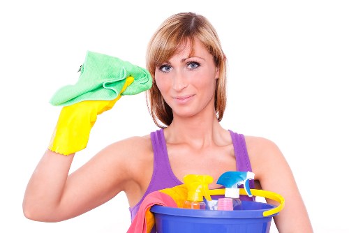 Cleaner working in a BR1 home near Bromley with vacuum and dusting tools