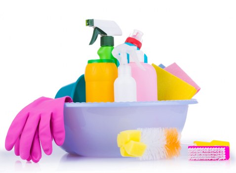 Worker performing carpet cleaning with safety precautions