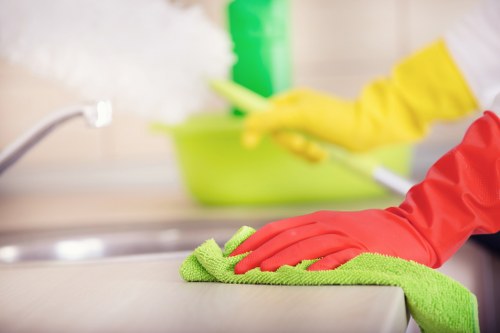 Cleaner polishing an oven door and interior in a BR1 home